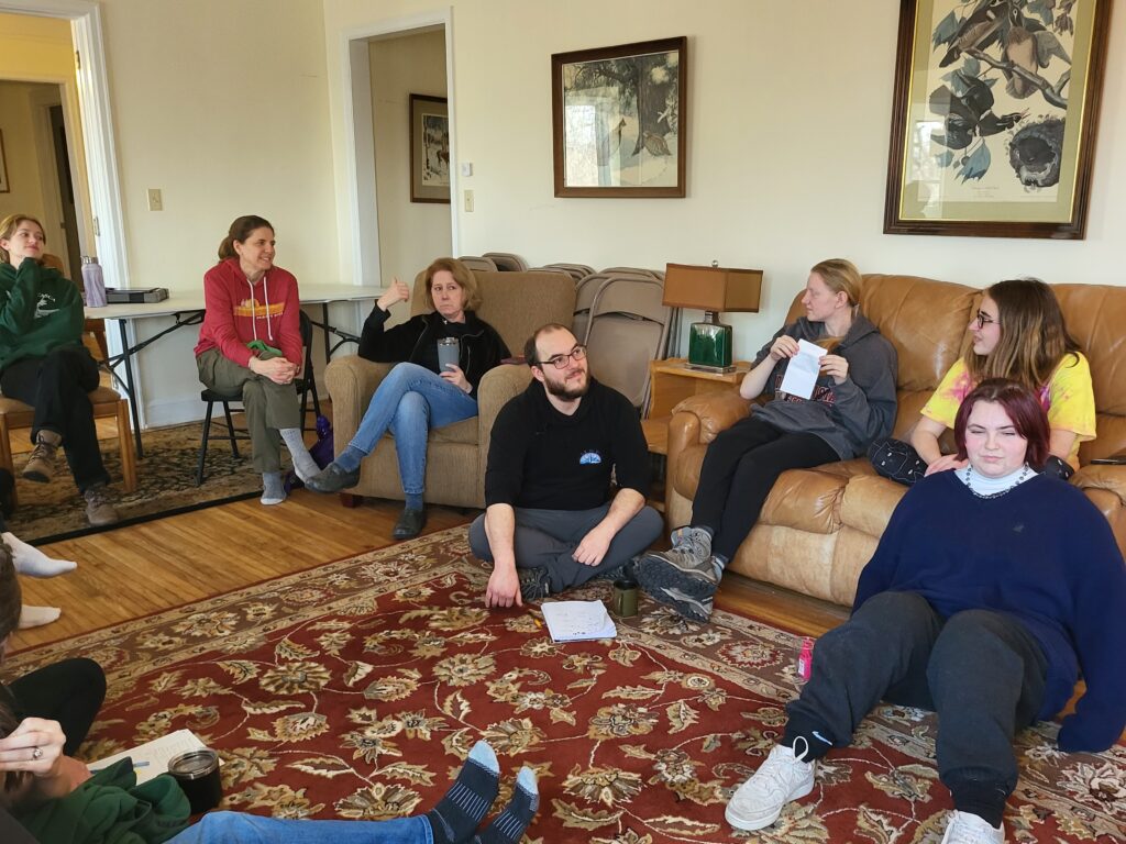 Green Crew youth and adult members participating together in a Leave No Trace training, exploring the principles of outdoor ethics through intergenerational environmental leadership.